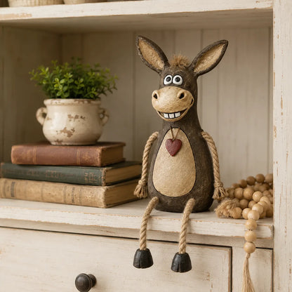 Rustic donkey figure on a plank with dangling rope legs