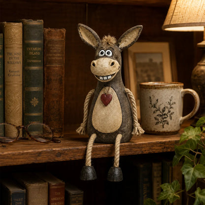 Rustic donkey figure on a plank with dangling rope legs